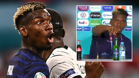 Paul Pogba moved a bottle of Heineken after helping France beat Germany © Lukas Barth-Tuttas / Reuters | © Twitter / ElijahKyama