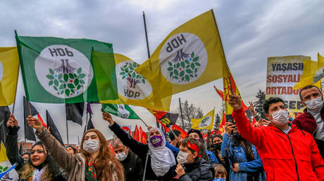 Pro-Kurdish Peoples' Democratic Party (HDP) supporters shout slogans and hold flags during a rally as part of Nowruz (Newroz). © Tunahan Turhan/SOPA Images/LightRocket via Getty Images