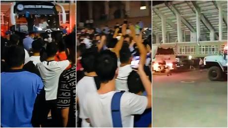 Terrifying Ord-eal: Riotous scenes as protesting football fans block team bus from leaving stadium after latest defeat (VIDEO)