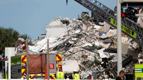 Emergency crew members search for missing residents in a partially collapsed building in Surfside, near Miami Beach, Florida, U.S., June 24, 2021.