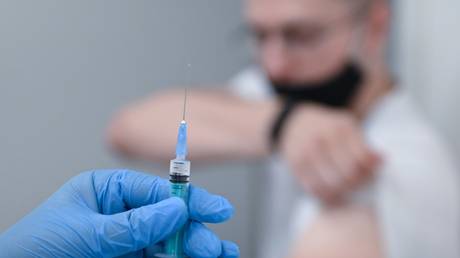 A student of Russian University of Transport (MIIT) receives a shot of Russia's Gam-COVID-Vac, trade-named Sputnik V, vaccine against the coronavirus disease at the university's clinic, in Moscow, Russia.