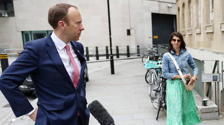 © Reuters / Matt Hancock and Gina Coladangelo stand outside the BBC headquarters in London, June 6, 2021