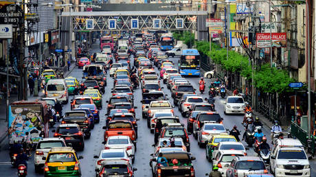 Cars sit in a traffic jam on a street in Bangkok on February 5, 2021.