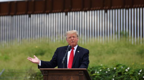 Former US President Donald Trump visits an unfinished section of the wall along the US-Mexico border in Pharr, Texas, June 30, 2021.