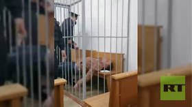 Belarusian opposition activist stabs himself in neck with pen during court hearing, accusing officials of targeting his family