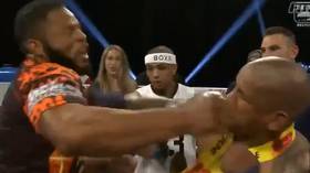 Hector Lombard appearing to trade blows with BKFC fighter, Lorenzo Hunt.