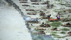 Dozens of bodies, many of them buried Covid victims, are washed from banks of India's Ganges by seasonal floods & float downriver