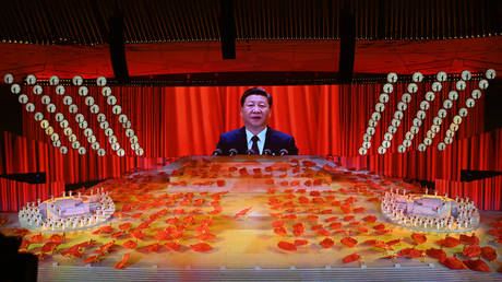 A picture of Chinese President Xi Jinping is seen on a large screen during a Cultural Performance as part of the celebration of the 100th Anniversary of the Founding of the Communist Party of China, at the Bird's nest national stadium in Beijing on June 28, 2021. © AFP / NOEL CELIS