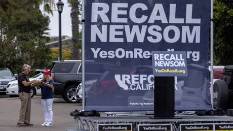 Supporters of the recall campaign of California Governor Gavin Newsom prepare for the upcoming recall election with a rally in Carlsbad, California, June 30, 2021.