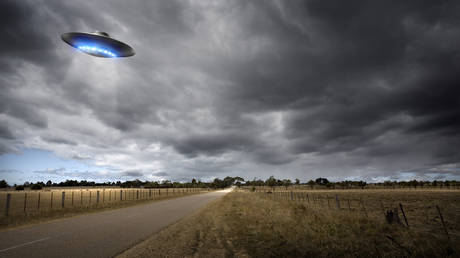 UFO on Country Road - stock photo