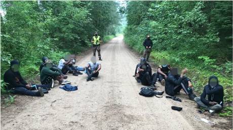 Migrants caught by the Lithuanian border service VSAT crossing from Belarus, July 2, 2021