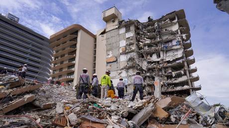 Search and rescue workers are shown on Friday at the site of the condominium collapse in Surfside, Florida.