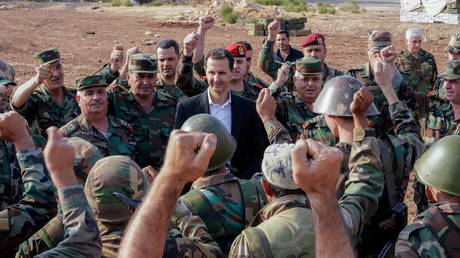 FILE PHOTO: Syrian President Bashar al Assad visits Syrian army troops in northwestern Idlib province