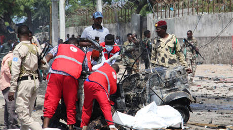 First responders at the scene of a terrorist attack in Mogadishu, Somalia, July 10, 2021. © AFP