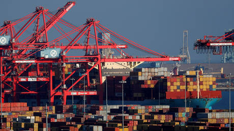 FILE PHOTO: Ships and shipping containers are pictured at the port of Long Beach in Long Beach, California, US