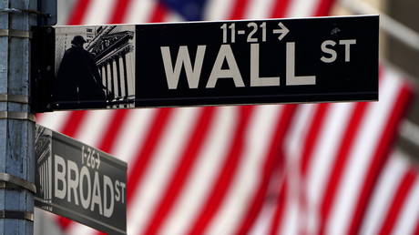 FILE PHOTO: A Wall Street sign is pictured outside the New York Stock Exchange in New York, US