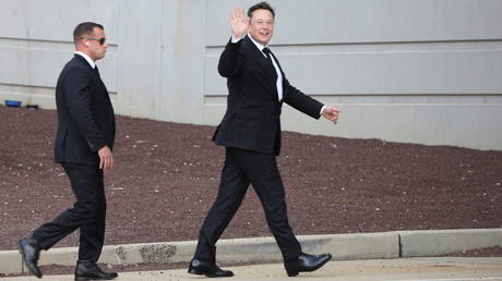 Tesla CEO Elon Musk gestures as he departs court in Wilmington, Delaware, US