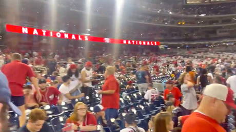 Spectators at the Nationals Park Stadium react after a shooting incident outside, in Washington, DC, U.S. July 17, 2021 © Solomon Tucker/via REUTERS