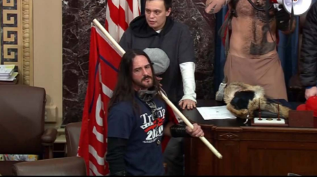 Paul Hodgkins, foreground, seen in the US Senate chamber on January 6, 2021 © US Department of Justice