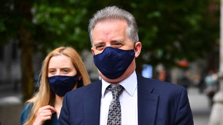 Christopher Steele, a former British spy who wrote a 2016 dossier about alleged links between Donald Trump and Vladimir Putin, leaves the High Court in London following a hearing in the libel case brought against him by Russian businessman Aleksej Gubarev. © Victoria Jones/PA Images via Getty Images