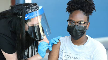 College student Landrianna Carruth is shown receiving a Covid-19 vaccine on Thursday in Memphis, Tennessee.