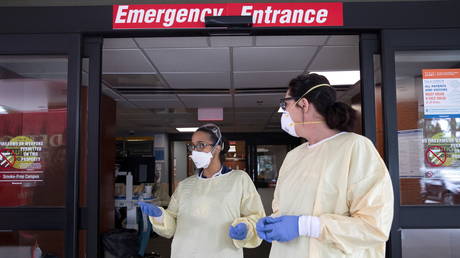 Nurses outside emergency room at Beaumont Hospital as they manage influx of coronavirus disease (COVID-19) cases in Grosse Pointe, Michigan