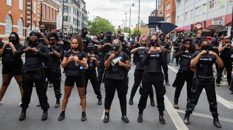 FILE PHOTO. Members of FF Force AKA Forever Family chant slogans outside Brixton town hall during the annual Emancipation day. © Getty Images / Thabo Jaiyesimi