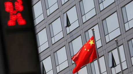 Chinese national flag flutters outside the China Securities Regulatory Commission (CSRC) building on the Financial Street in Beijing, China