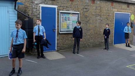 Year six pupils arrive at St John's Primary School in Fulham, West London, Britain, June 2, 2020.