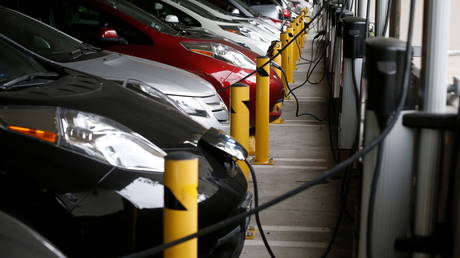 FILE PHOTO: Electric cars sit charging in a parking garage at the University of California, Irvine.