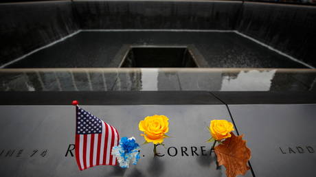 A flag and a flower at the 9/11 Memorial in New York City, November 11, 2020.