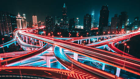 Aerial view of road intersection in Shanghai at night.