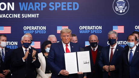 Donald Trump signs an executive order on vaccine distribution during an Operation Warp Speed Vaccine Summit at the White House in Washington, US, December 8, 2020.