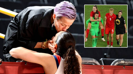 Football star Rapinoe congratulates 1st transgender Olympic champ &ndash; and kisses basketball great girlfriend Bird after she wins too