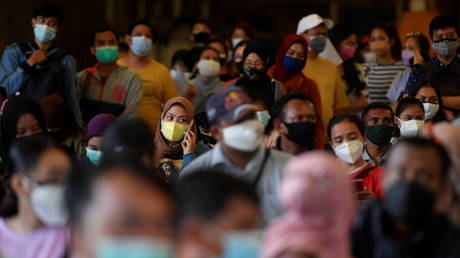 Indonesia extends Covid restrictions in some areas, announces plans to ease measures where cases falling