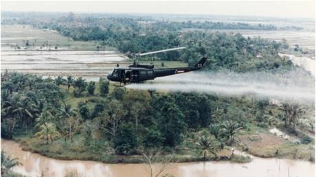 A US military helicopter sprays Agent Orange over Vietnam. © Wikipedia