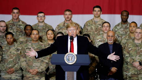 FILE PHOTO: U.S. President Donald Trump delivers remarks to U.S. troops, with Afghanistan President Ashraf Ghani standing behind him, during an unannounced visit to Bagram Air Base, Afghanistan, November 28, 2019. © REUTERS/Stringer