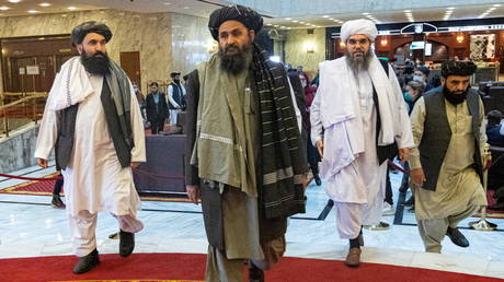 Mullah Abdul Ghani Baradar and other delegation members. © Reuters / Alexander Zemlianichenko