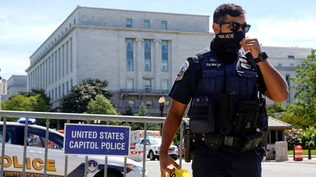 US Capitol Police officer mans a police barricade as police investigated a bomb threat near the US Capitol in Washington DC