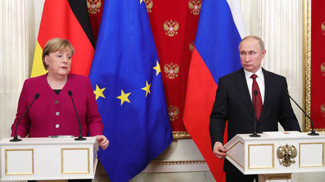 FILE PHOTO: Russian President Vladimir Putin and German Chancellor Angela Merkel attend a joint news conference following their meeting at the Kremlin in Moscow, Russia January 112020.
