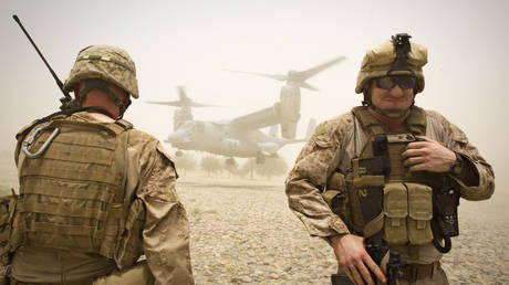 US Marines of Weapons Company, 1st Battalion, 3rd Marines stand as a V-22 Osprey aircraft lands at the Camp Gorgak in Helmand province, southern Afghanistan (FILE PHOTO) © REUTERS/Shamil Zhumatov