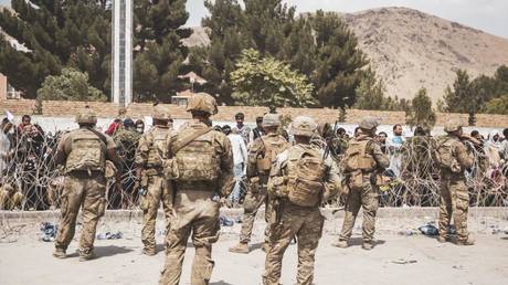 US Marines assist with security at an Evacuation Control Checkpoint during an evacuation at Hamid Karzai International Airport, Kabul, Afghanistan, August 19, 2021