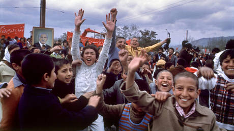 FILE PHOTO. Young supporters of the Afghan communist regime march through the streets of the capital Kabul 28 April 1979 to mark the first anniversary of the Moscow-backed April Revolution. © AFP / S. SOBOLEV