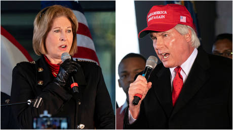FILE PHOTO: Attorneys Sidney Powell (L) and Lin Wood (R) speak at a press conference on the 2020 election results in Alpharetta, Georgia, December 2, 2020.