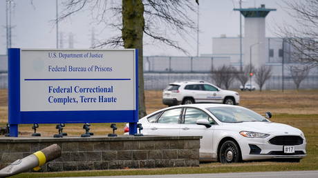 Prison officials patrol around the United States Penitentiary at the Federal Correctional Complex in Terre Haute