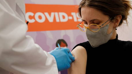 FILE PHOTO. A woman receives a dose of Sputnik V (Gam-COVID-Vac) vaccine against the coronavirus disease (COVID-19) at a vaccination centre in a shopping mall in Saint Petersburg, Russia. © Reuters / Anton Vaganov