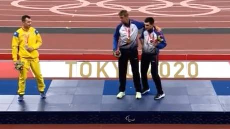 Ihor Tsvietov of Ukraine was seen ignoring an invitation to join his Russian rivals at the top of the podium. © Screenshot Twitter Match TV