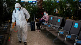 China reimposes restrictions on overseas travel amid crackdown to control jump in Covid cases
