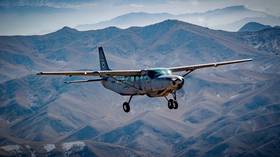 Uzbekistan says it shot down Afghan military plane that violated its borders, amid exodus of government officials from Kabul