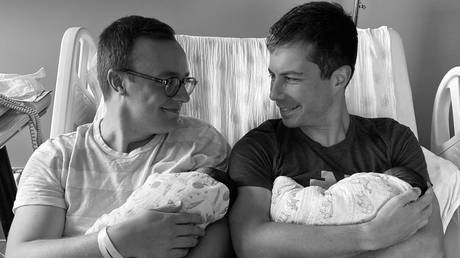 Pete Buttigieg and his husband Chasten introduce their two babies, Penelope Rose and Joseph August, in a social media photo